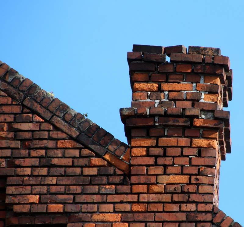 Damaged chimney on an Lauderhill home showing cracks and missing mortar